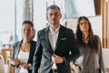 Group of successful business people standing together at office. Royalty Free Stock Photo