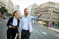 Group of successful business people working, walking in a city street. Royalty Free Stock Photo