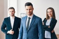 Group of successful business team and their pretty leader in front Royalty Free Stock Photo