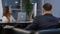 Group of successful businesspeople talking together while working around a table in an office boardroom Royalty Free Stock Photo