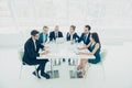 Group of successful businesspeople talking together while working around table in office Royalty Free Stock Photo