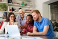 Group of successful happy multiethnic business people working as a team in office on meeting. Royalty Free Stock Photo