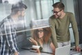 Group of successful multicultural business people or colleagues working together in the modern office, discussing new Royalty Free Stock Photo