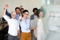 Group of successful multiethnic business people celebrating a good job in the office Royalty Free Stock Photo
