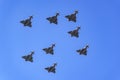 Group of supersonic planes in formation flying in the sky in a military parade.