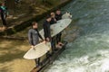 Group of surfers standing by