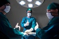 Group Surgeon doctor consent after Patient surgery in hospital operating room. Royalty Free Stock Photo