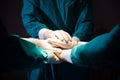 Group Surgeon doctor joining hands before Patient surgery in hospital operating room. Royalty Free Stock Photo