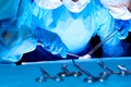 Group of surgeons in masks performing operation. Medicine, surgery and emergency help concepts Royalty Free Stock Photo