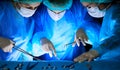 Group of surgeons in masks performing operation. Medicine, surgery and emergency help concepts Royalty Free Stock Photo