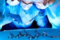 Group of surgeons in masks performing operation. Medicine, surgery and emergency help concepts Royalty Free Stock Photo