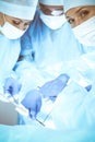 A group of surgeons is operating at the hospital. Health care concept