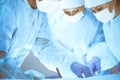 A group of surgeons is operating at the hospital. Health care concept