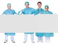 Group of surgeons presenting empty banner