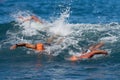 Group swimmers swimming crawl in blue sea