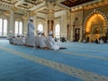 Group of Tahfiz Student performing prayer inside the mosque