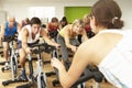 Group Taking Part In Spinning Class In Gym