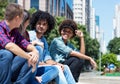 Group of talking young adults in the city Royalty Free Stock Photo