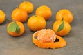 Group of tangerines-whole tangerine with leaves and peeled tangerine