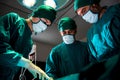 Group and teamwork of surgeons in hospital operating theater. Royalty Free Stock Photo