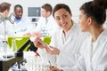 Group Of Technicians Working In Laboratory Royalty Free Stock Photo