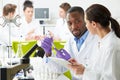 Group Of Technicians Working In Laboratory Royalty Free Stock Photo