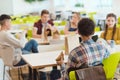 group of teen students chatting while taking lunch Royalty Free Stock Photo