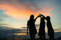 Group teen women asian drinking beer from bottles in the midst of nature. While standing back when the sunset