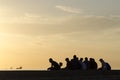 Group of teenage boys in sunset