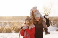 Group of teenage friends having fun snow in winter Royalty Free Stock Photo