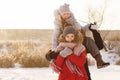 Group of teenage friends having fun snow in winter Royalty Free Stock Photo