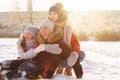 Group of teenage friends having fun snow in winter Royalty Free Stock Photo