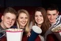 Group Of Teenage Friends Watching Film In Cinema Royalty Free Stock Photo