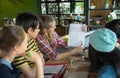 Group of teenage friends working and meeting in team with reports