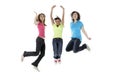 Group of Teenage Girlfriends Jumping in Studio Royalty Free Stock Photo