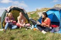 Group Of Teenage Girls On Camping Trip In Countryside