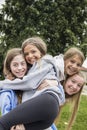 Group of teenage girls playing and smiling together outdoors Royalty Free Stock Photo