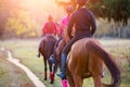 Group of teenage girls riding horse in autumn park Royalty Free Stock Photo