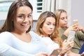 Group Of Teenage Girls Using Mobile Phones At Home Royalty Free Stock Photo