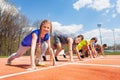 Group of teenage runners lined up ready to race