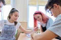 Group of teenage students in the classroom sitting at their desks Royalty Free Stock Photo