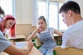 Group of teenage students in the classroom sitting at their desks Royalty Free Stock Photo
