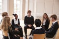 Group Of Teenage Students Having Discussion In Class Together