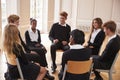 Group Of Teenage Students Having Discussion In Class Together