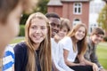 Group Of Teenage Students Sitting Outside School Buildings Royalty Free Stock Photo
