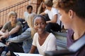 Group Of Teenage Students Socialising On College Campus Together