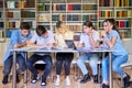 Group of teenage students study in library class. Royalty Free Stock Photo