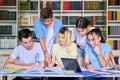 Group of teenage students study in library class. Royalty Free Stock Photo