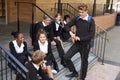 Group Of Teenage Students In Uniform Outside School Building Royalty Free Stock Photo