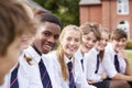 Group Of Teenage Students In Uniform Outside School Buildings Royalty Free Stock Photo